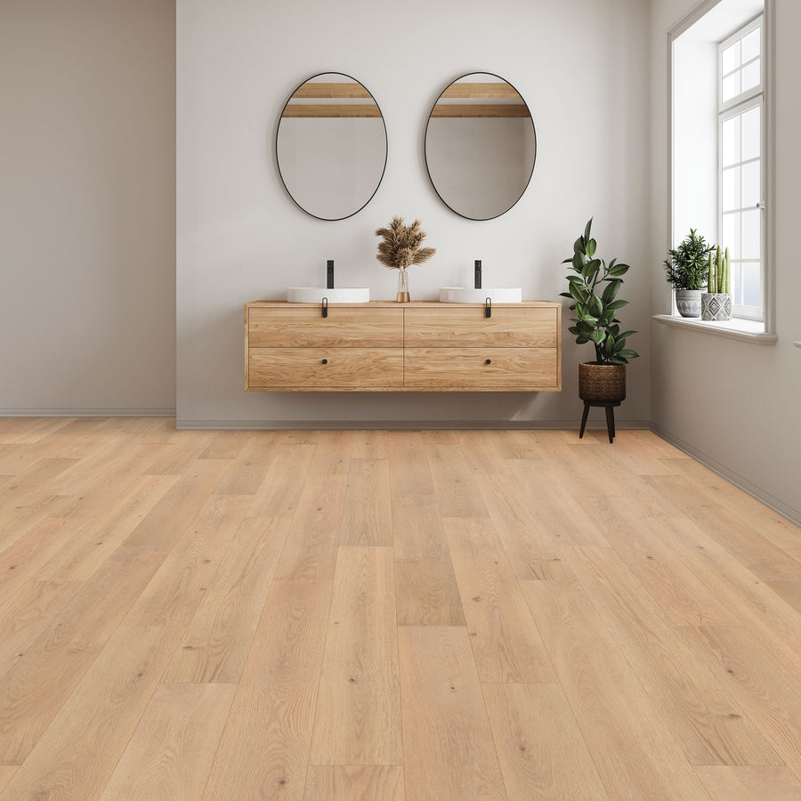 A modern bathroom featuring Woodlette Estates 7 1/2" Waterproof Laminate in a light wood look, a floating double-sink vanity with round mirrors, abundant natural light from a window, and potted plants for decor.