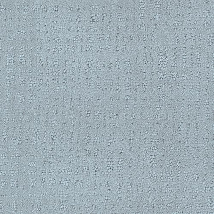 Homage Berber Carpet in Coronado features light blue textured fabric with a subtle, irregular dotted and dashed pattern, creating depth and variation—ideal for high-traffic areas with its soft, woven look.