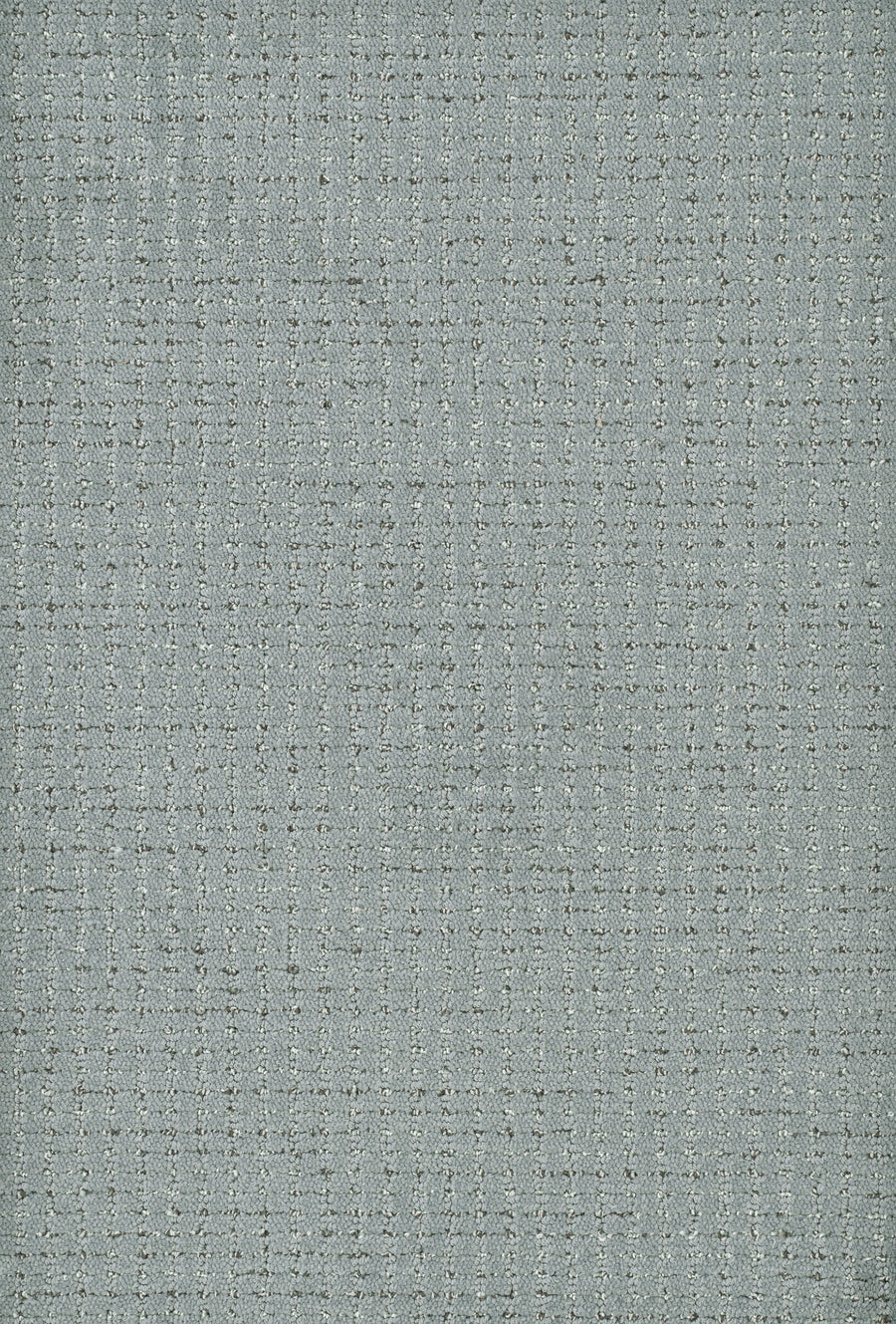 Chalet On Trend Carpet features a light blue-gray textured fabric with a subtle grid pattern and woven appearance, offering a soft, neutral tone inspired by luxurious carpet design.