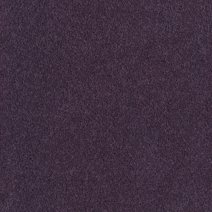 Close-up of Tribute Family Friendly Carpet in Couleur: a textured, dark purple suede-like fabric with a soft, uniform surface—durable and stain resistant, perfect for any family-friendly space.