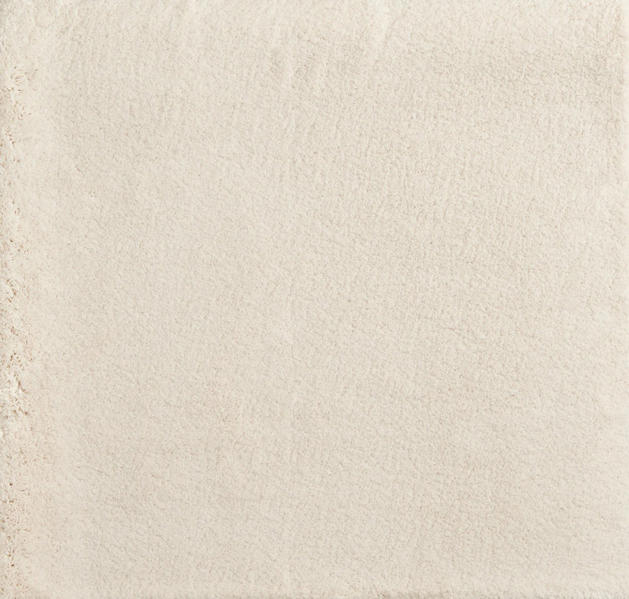 A close-up of Cha Cha On Trend Carpet in Cream shows its smooth, even surface with a slightly textured area, evoking the look and durability of flooring often used in contemporary high-traffic spaces.