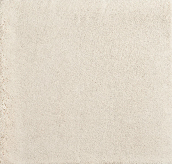 A close-up of Cha Cha On Trend Carpet in Cream shows its smooth, even surface with a slightly textured area, evoking the look and durability of flooring often used in contemporary high-traffic spaces.