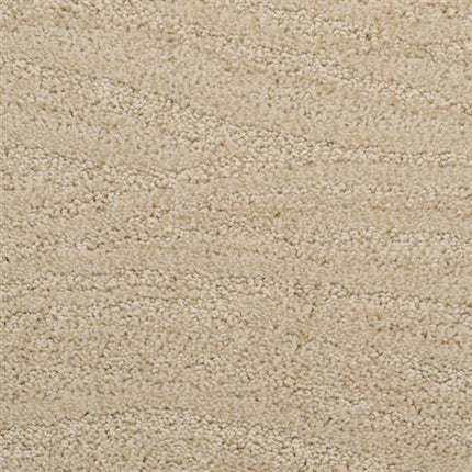 Close-up view of Taittinger On Trend Carpet in Crown Point, showcasing a subtle wavy pattern and plush, soft surface—ideal for those desiring durable yet luxurious flooring.
