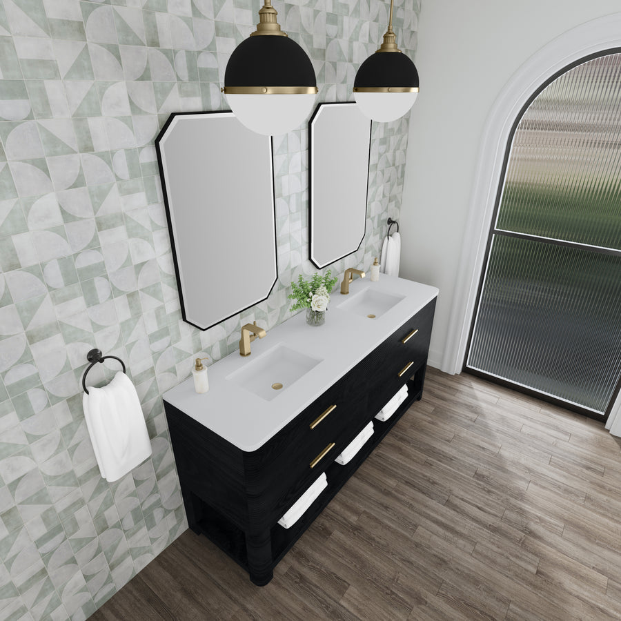 Modern bathroom with geometric tile accent wall, double vanity with gold fixtures, two rectangular mirrors, black lamps, and a large arched window letting in natural light. Towels are neatly folded on a shelf below the sinks.
