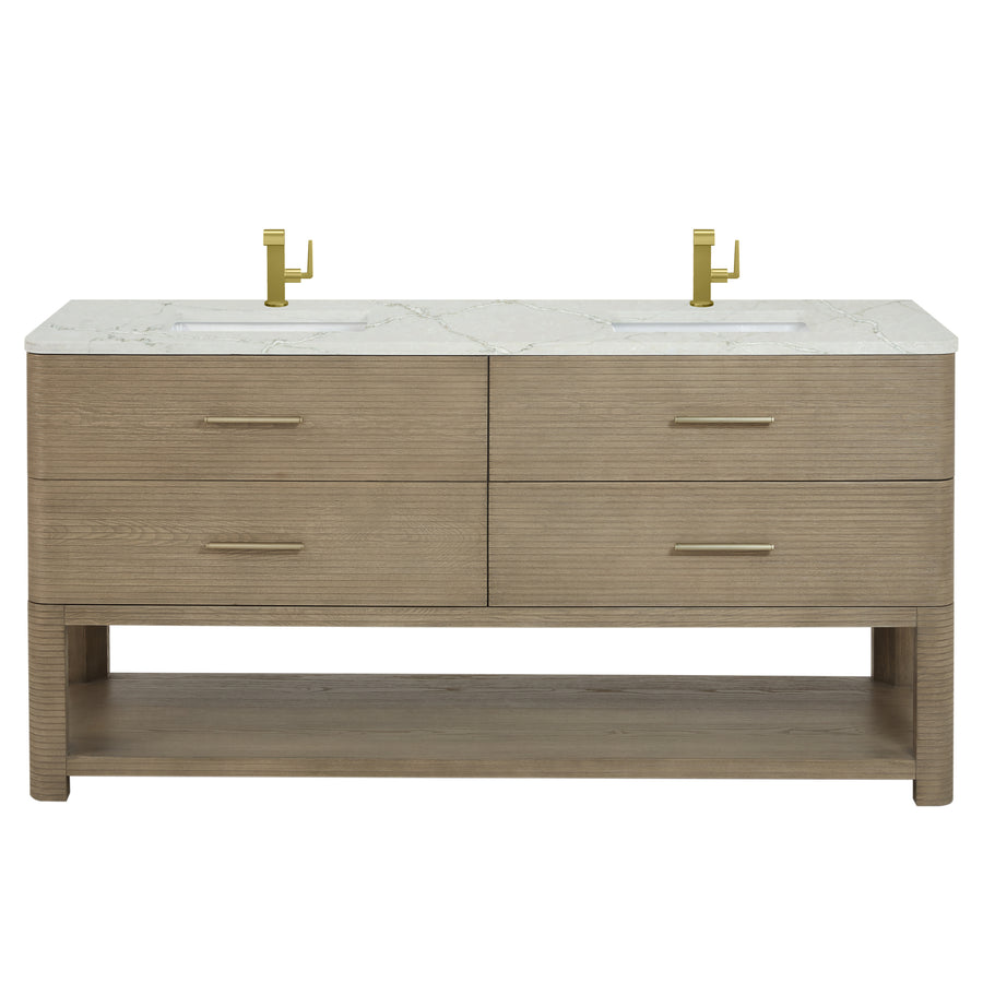 A modern double-sink bathroom vanity with a light wood finish, four drawers, an open lower shelf, and a white marble countertop. Two gold faucets are mounted above the sinks.
