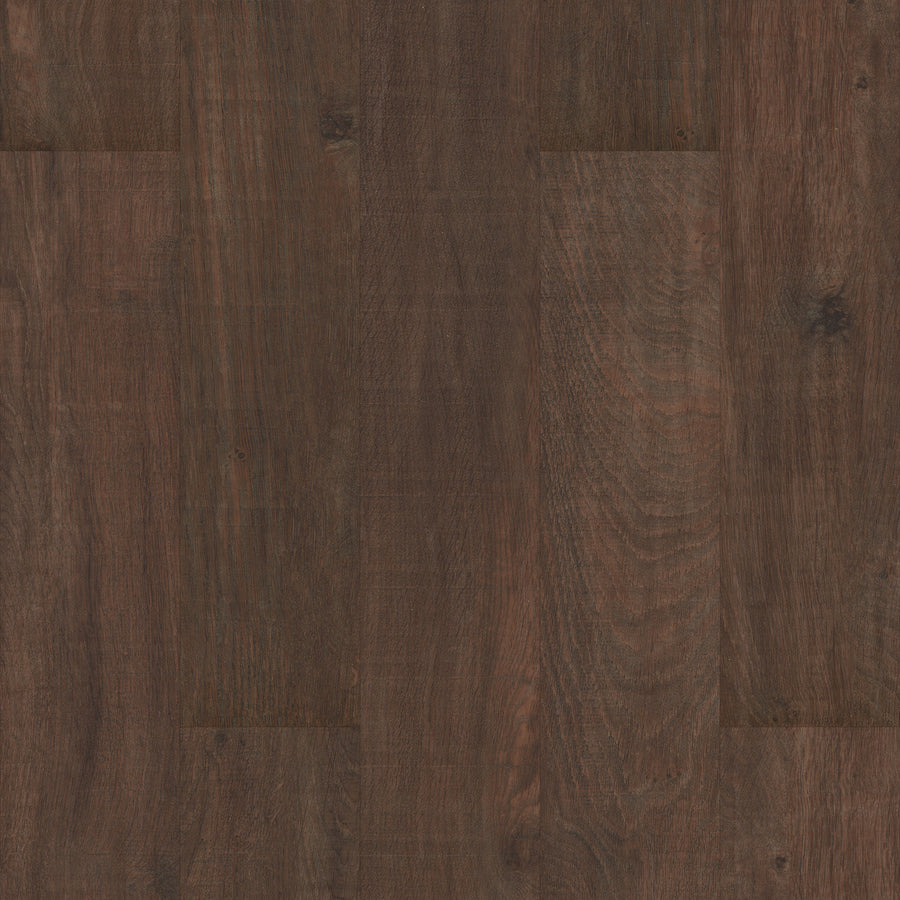 Coretec Originals Classics Vinyl features dark brown planks with a natural grain pattern and subtle shade variations, offering a warm, rustic look. The rigid core construction ensures a smooth, continuous surface when installed side by side.