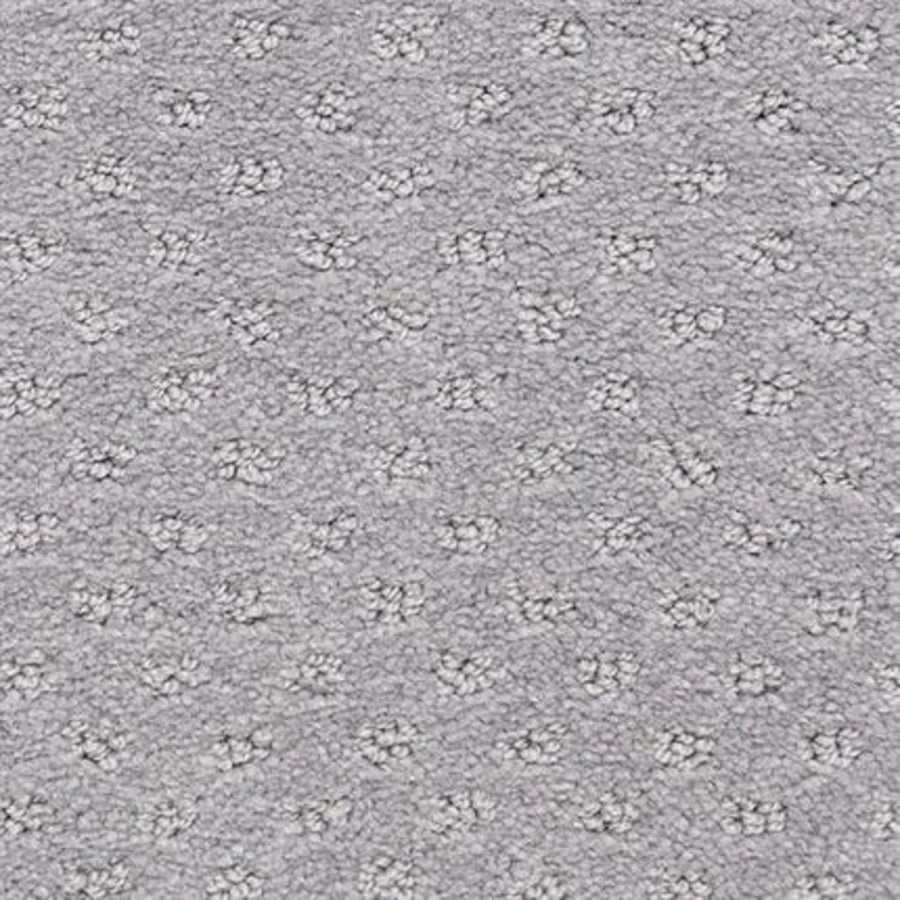 Close-up of the Dreamer On Trend Carpet in Davy Gray, showing a light gray textured surface with subtle dotted pattern and evenly spaced plush tufts—an inviting option for luxury flooring.