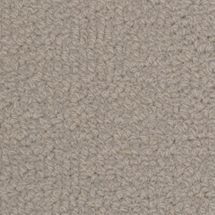 Close-up of Savant Berber Carpet in Deblois, highlighting its textured, tightly woven fibers and uniform pattern—making it a durable flooring option for high-traffic spaces.