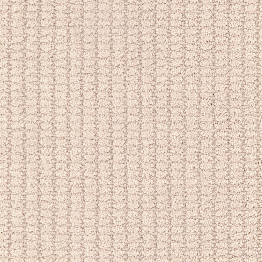 Close-up of the Defined Family Friendly Carpet in light beige, featuring a soft, textured grid pattern formed by raised vertical and horizontal lines. This carpet offers luxurious comfort and superior quality for your home.