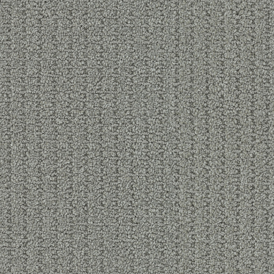 Close-up of Defined Family Friendly Carpet, a grey looped pile with subtle lines, offering soft luxury and superior quality—ideal for creating a uniform, stylish, and family-friendly space.