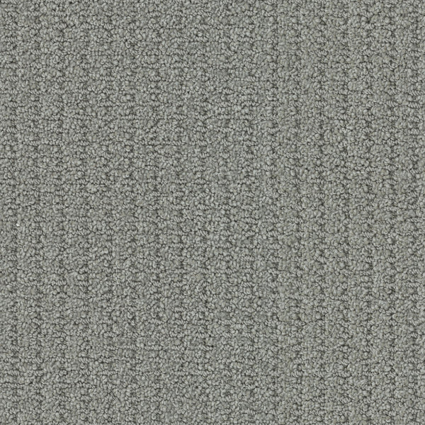 Close-up of Defined Family Friendly Carpet, a grey looped pile with subtle lines, offering soft luxury and superior quality—ideal for creating a uniform, stylish, and family-friendly space.
