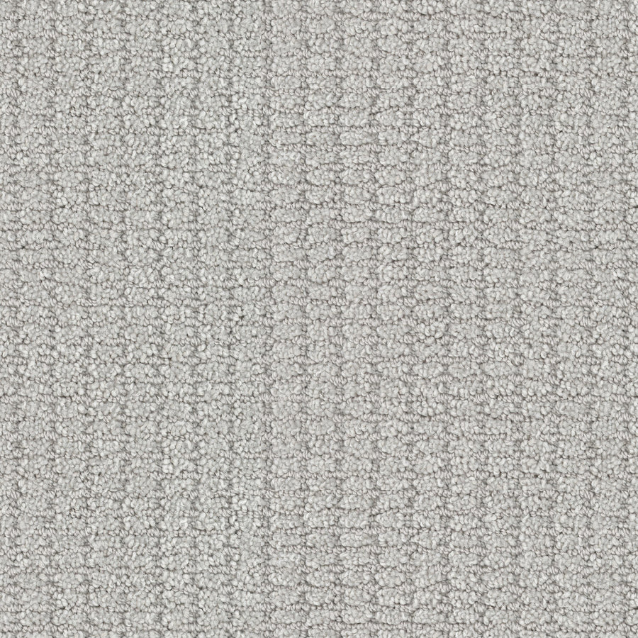 Close-up of Defined Family Friendly Carpet: a light gray looped pile with a subtle square pattern, delivering soft luxury and a uniform look—ideal for those seeking top-quality, family-friendly flooring.