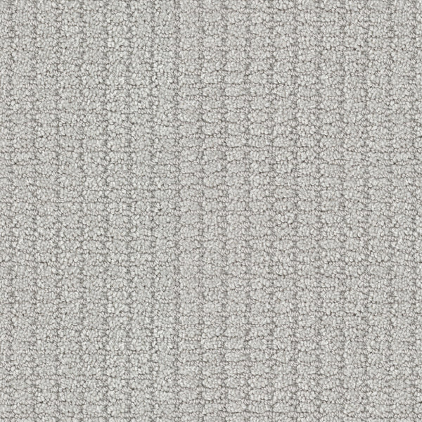 Close-up of Defined Family Friendly Carpet: a light gray looped pile with a subtle square pattern, delivering soft luxury and a uniform look—ideal for those seeking top-quality, family-friendly flooring.