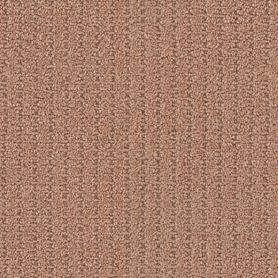 Close-up of the Defined Family Friendly Carpet, a textured looped carpet in warm light brown with a subtle linear pattern, delivering superior quality and soft comfort—ideal as a family-friendly choice for any home.