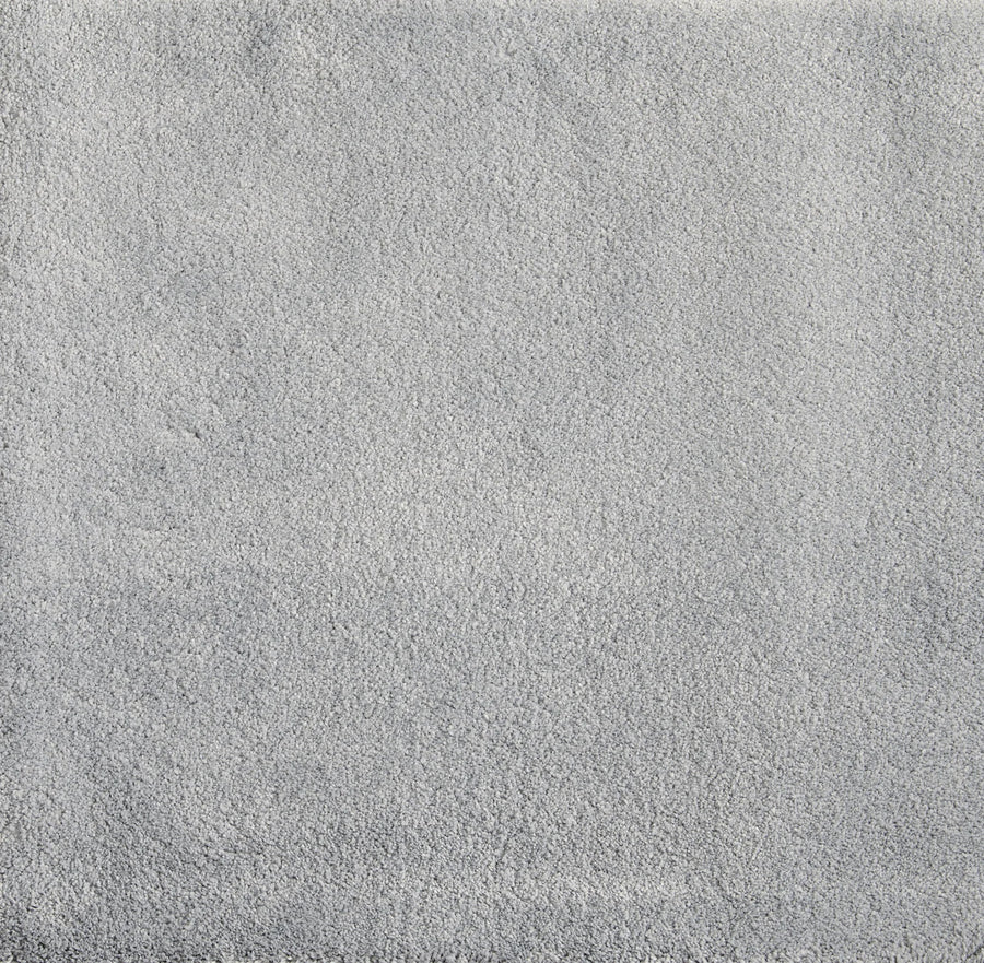 A close-up of Cha Cha On Trend Carpet in Denim shows a soft, textured surface with subtle shading and mottled detail—ideal for contemporary spaces and high-traffic areas.