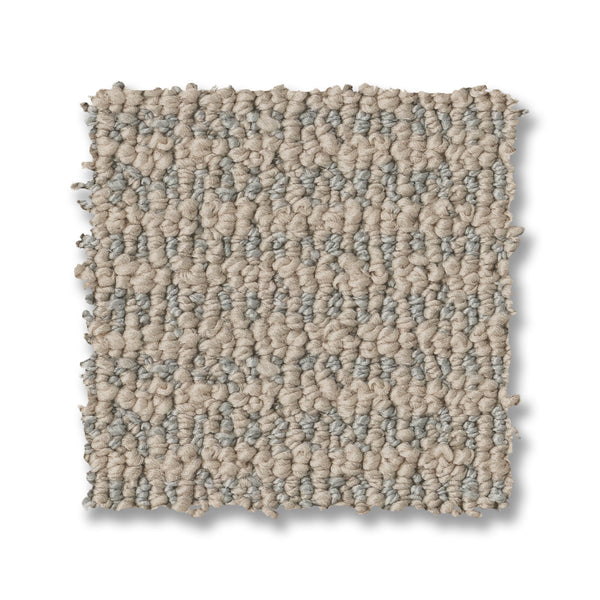 A square sample of Laine On Trend Carpet displays a beige and light gray looped pattern, highlighting its textured design on a white background.