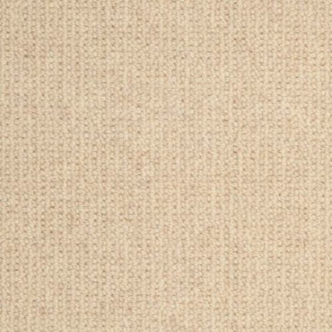 Close-up view of the Dublin Berber Carpet in Donohue color, showcasing its beige knitted fabric with a simple, even texture and distinct stitch pattern, echoing classic Berber carpet style.