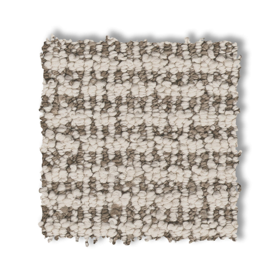 A square swatch of Laine On Trend Carpet displays its looped pile and alternating beige and taupe stripes, highlighting the carpet’s textured design on a white background.