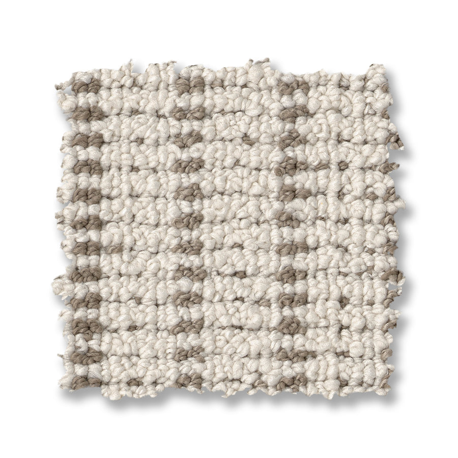 A square swatch of Laken On Trend Carpet in light beige features a textured, looped surface with a subtle grid pattern of taupe lines on a white background.