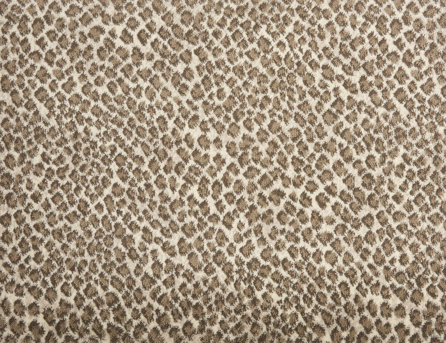 Close-up of Serengeti On Trend Carpet in Dune, showcasing a brown and beige leopard print with irregular spots—an ideal choice for adding a contemporary touch to your space.