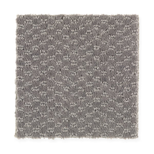 A square sample of Dynamo Family Friendly Carpet in Ancient Marble, featuring a textured gray tone and subtle repeating looped pattern on a white background.