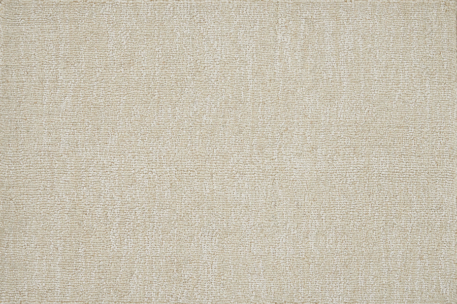 A close-up of the Effervescense On Trend Carpet in Ice highlights its soft, beige textured fabric with a subtle woven pattern. This luxurious, uniform surface offers gentle shading—ideal for enhancing any modern interior style.