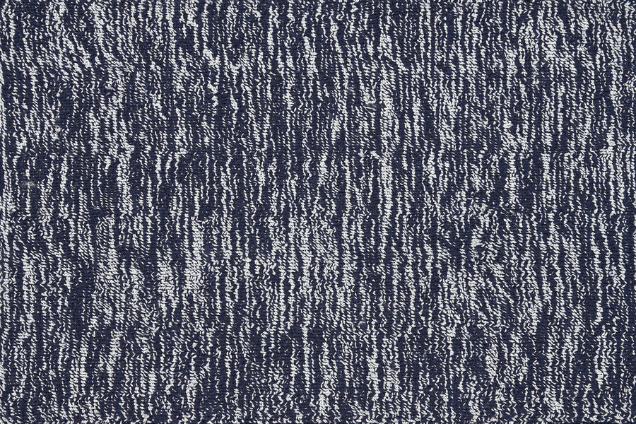 Close-up of the Effervescense On Trend Carpet in Ink, showing its luxurious, contemporary textured surface with vertical dark blue and white stripes for a modern woven effect.