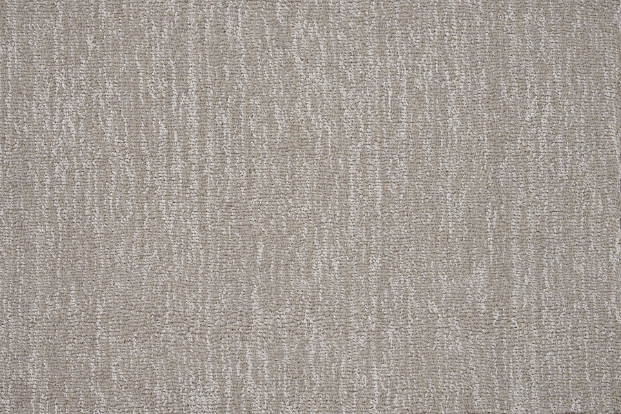 Close-up view of the Effervescense On Trend Carpet in Mist, showcasing a luxurious, contemporary look with its soft, textured pattern of lighter and darker fibers for a subtly wavy effect.