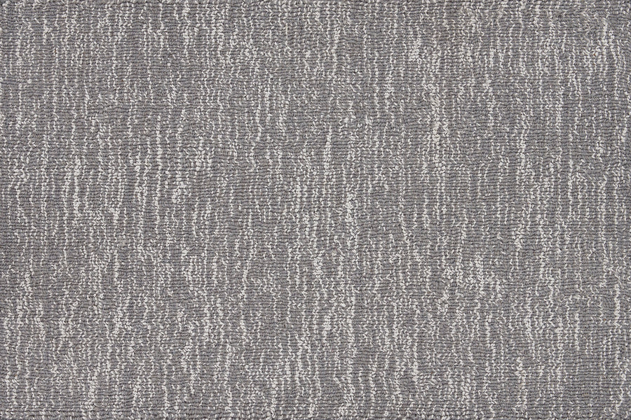 Close-up of the Effervescense On Trend Carpet in Steel—its textured gray surface features an abstract linear pattern in light and dark shades, making it perfect for modern, contemporary interiors.