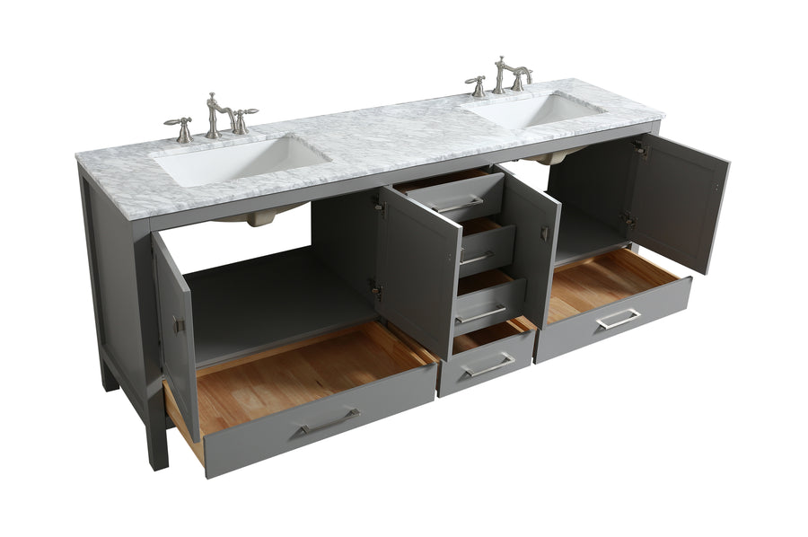 A double bathroom vanity with a marble countertop, two sinks, and gray cabinets. All cabinet doors and drawers are open, showing interior shelving and storage space.