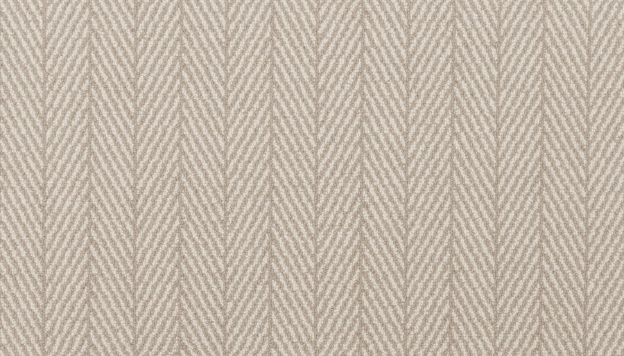 Close-up of Eastleigh Berber Carpet in Mocha, showing its soft, slightly raised surface with a subtle herringbone pattern—rows of diagonal lines forming a repeating V-shaped design reminiscent of luxury carpets.