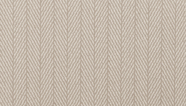 Close-up of Eastleigh Berber Carpet in Mocha, showing its soft, slightly raised surface with a subtle herringbone pattern—rows of diagonal lines forming a repeating V-shaped design reminiscent of luxury carpets.