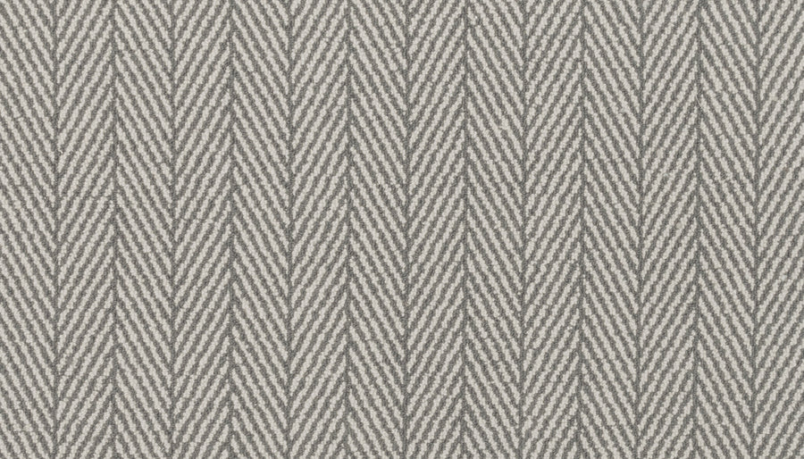Close-up of Eastleigh Berber Carpet in Pewter, showcasing a light gray and white herringbone pattern with zigzag lines—perfect for high-traffic areas or as inspiration for luxurious carpet designs.