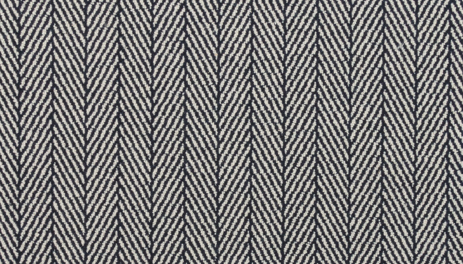 Close-up of Eastleigh Berber Carpet in Flint: features a black and white herringbone pattern with V-shaped diagonal lines, creating a stylish zigzag design—perfect for luxury, high-traffic areas.