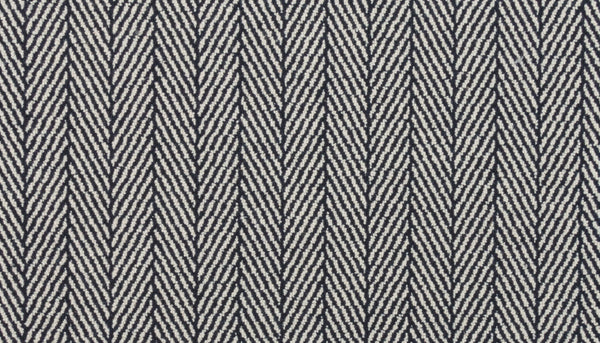Close-up of Eastleigh Berber Carpet in Flint: features a black and white herringbone pattern with V-shaped diagonal lines, creating a stylish zigzag design—perfect for luxury, high-traffic areas.