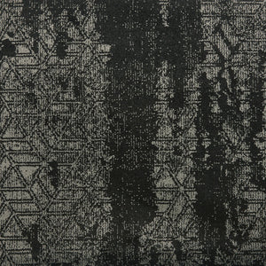 Delphi On Trend Carpet in Ebony features a textured fabric with a distressed, abstract black and gray pattern, including subtle zigzags and geometric shapes with vertical streaks—perfect for elegant, modern flooring.
