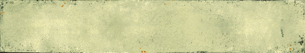 The Eclipse 2x18 Glazed Porcelain Tile features a distressed, vintage look with frayed edges and a faded yellow tint, along with dark stains that echo the character of an aged architectural piece.