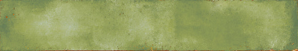 The Eclipse 2x18 Glazed Porcelain Tile features a rectangular shape, weathered green tones, a textured mottled finish, and subtle rust or brown edges for an aged rustic look.