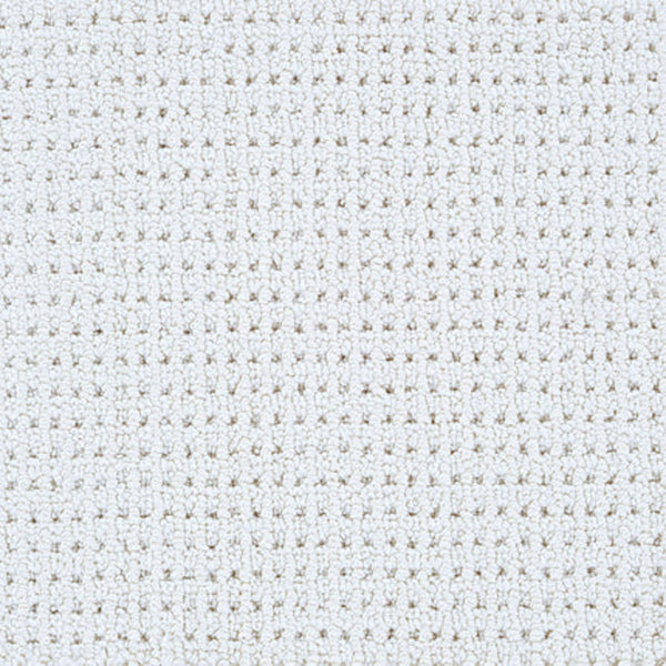Close-up of Top Notch Berber Carpet in Ecru, featuring a textured white woven surface with a grid-like pattern—subtly elegant, stain resistant, and defined by small, evenly spaced squares formed by intersecting threads.