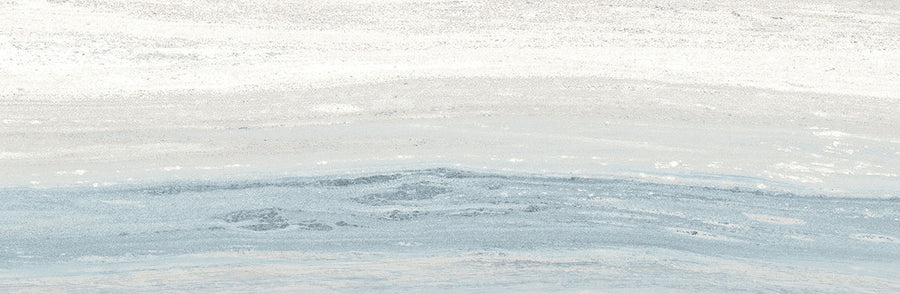 Abstract image with soft white, light gray, and pale blue layers evokes watercolor brushstrokes and serene landscapes, featuring subtle textures that suggest the refined elegance of Element 4x12 Glossy Tile in a tranquil setting.