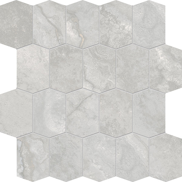 Stream Elongated Hex Porcelain Tile features light gray hexagonal tiles in a honeycomb pattern, each with subtle texture and shade variations that mimic natural travertine.