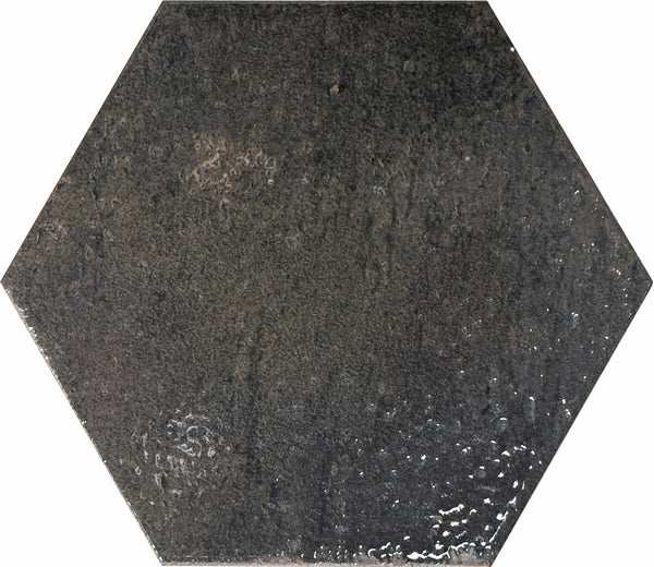 The Emerge 8x9 Hexagon Porcelain Tile in Eclipse offers a glossy, dark gray finish with relaxed beauty, natural variation, and a subtly textured, uneven surface.