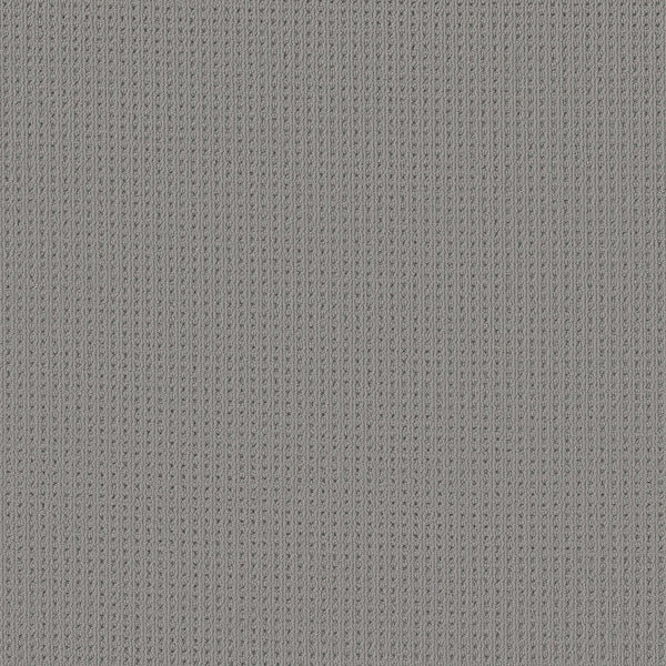 Close-up of San Lucas Family Friendly Carpet in Essential color, featuring a textured gray vertical ribbed pattern with evenly spaced stitches—ideal for busy, high-traffic homes.