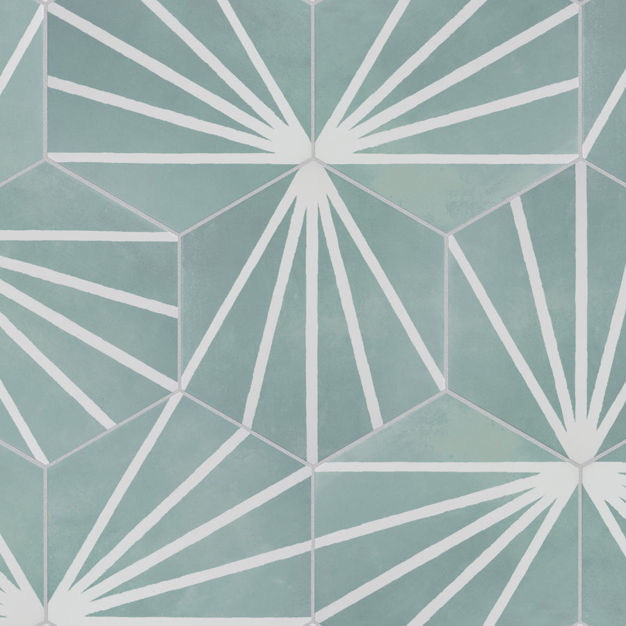 Geometric pattern featuring teal hexagons with white radial lines extending from the corners, creating a starburst effect within each hexagon on a textured background.