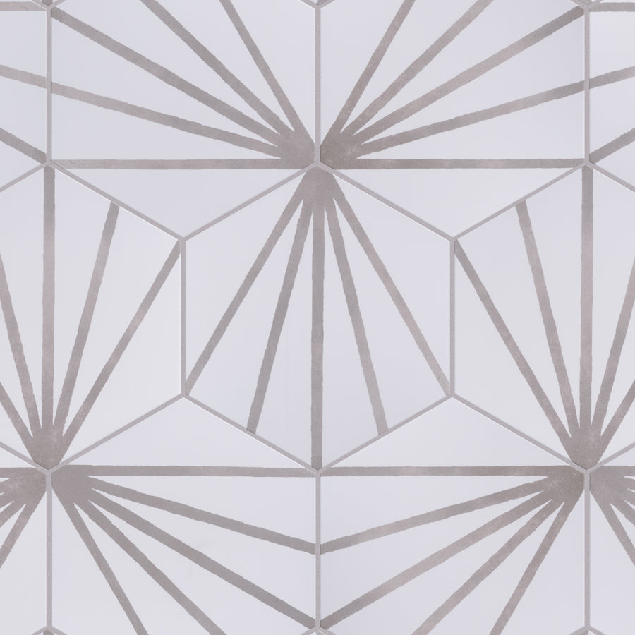 Geometric pattern featuring hexagons with radiating straight lines from the center of each hexagon, forming symmetrical starburst shapes in shades of light gray and white.