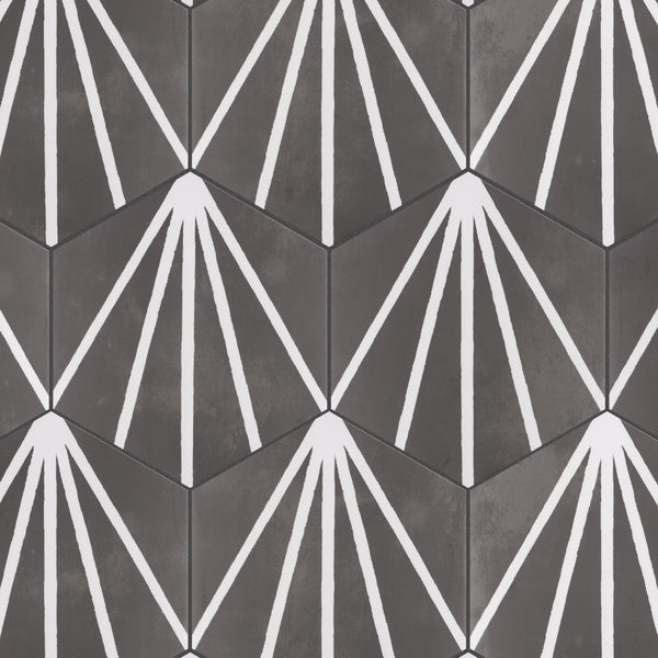 Hexagonal tiles in dark gray tones with a geometric pattern of white lines radiating from one corner of each tile, creating a repeating, sunburst-like design across the surface.