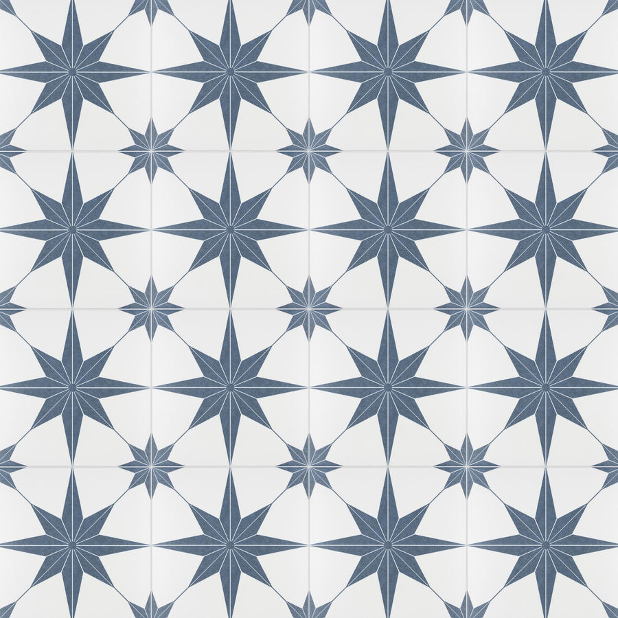 A repeating pattern of blue eight-pointed stars on a white background, creating a geometric and symmetrical tile design.