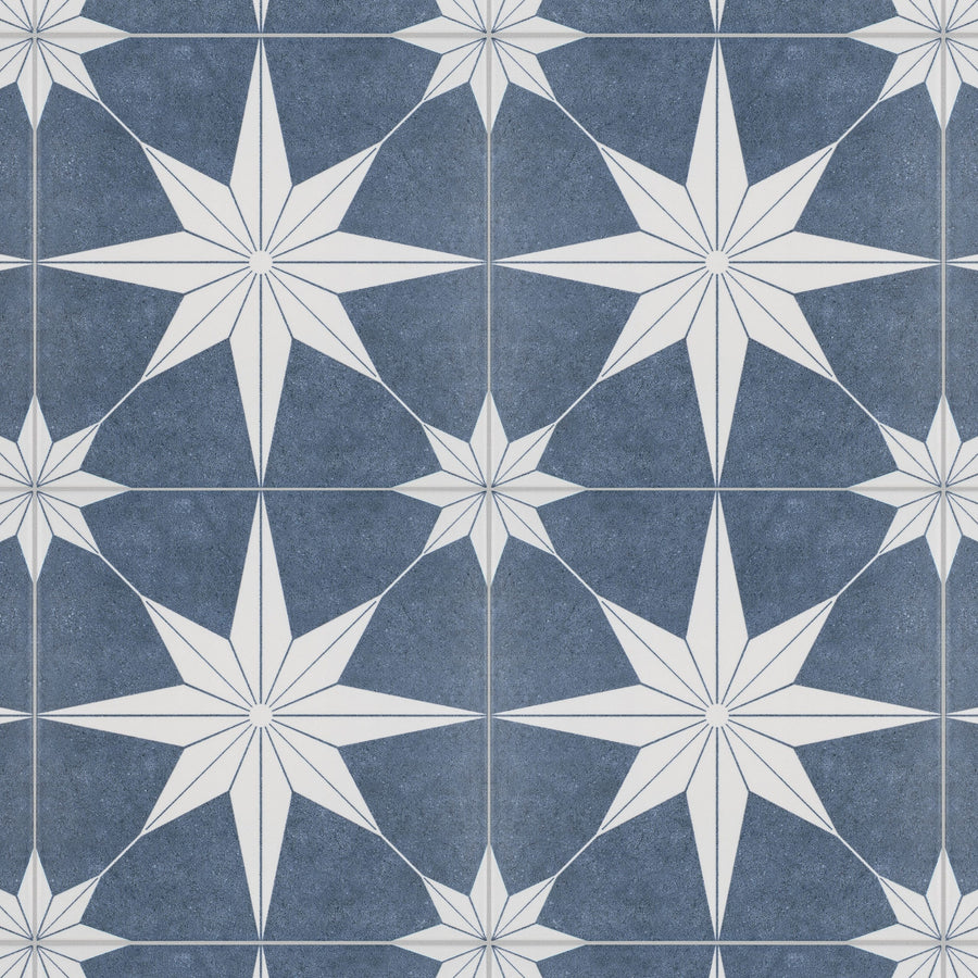 Patterned tile design featuring repeating white eight-pointed stars on a blue background, with smaller star shapes between larger ones, forming a geometric and symmetrical motif.