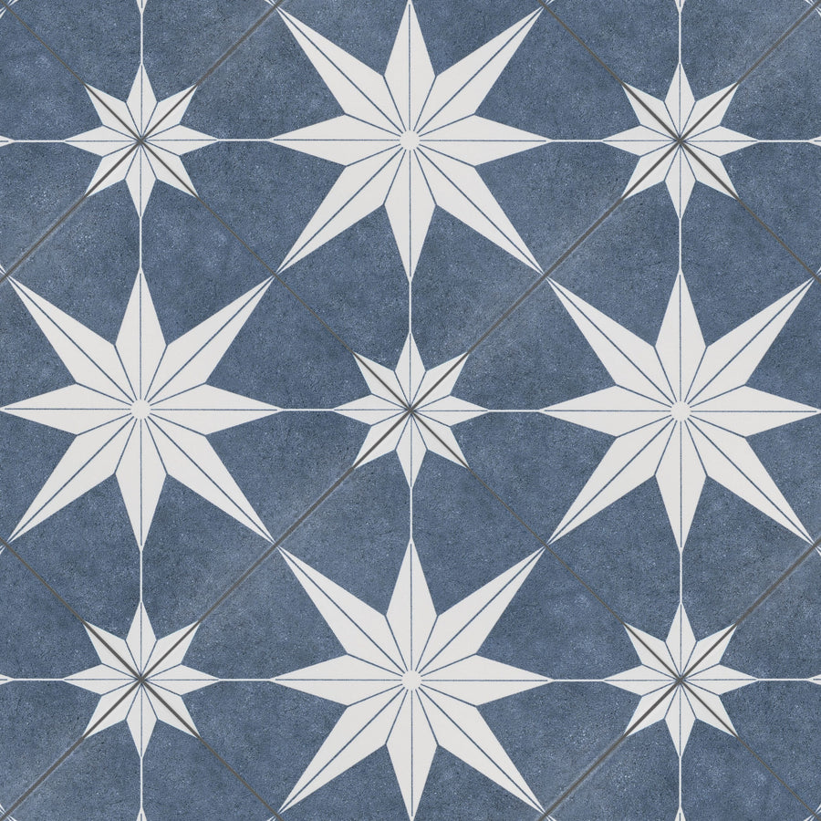 A repeating pattern of white eight-pointed stars on a textured dark blue background, separated by thin gray lines that form a grid-like structure. The design has a geometric, tile-like appearance.