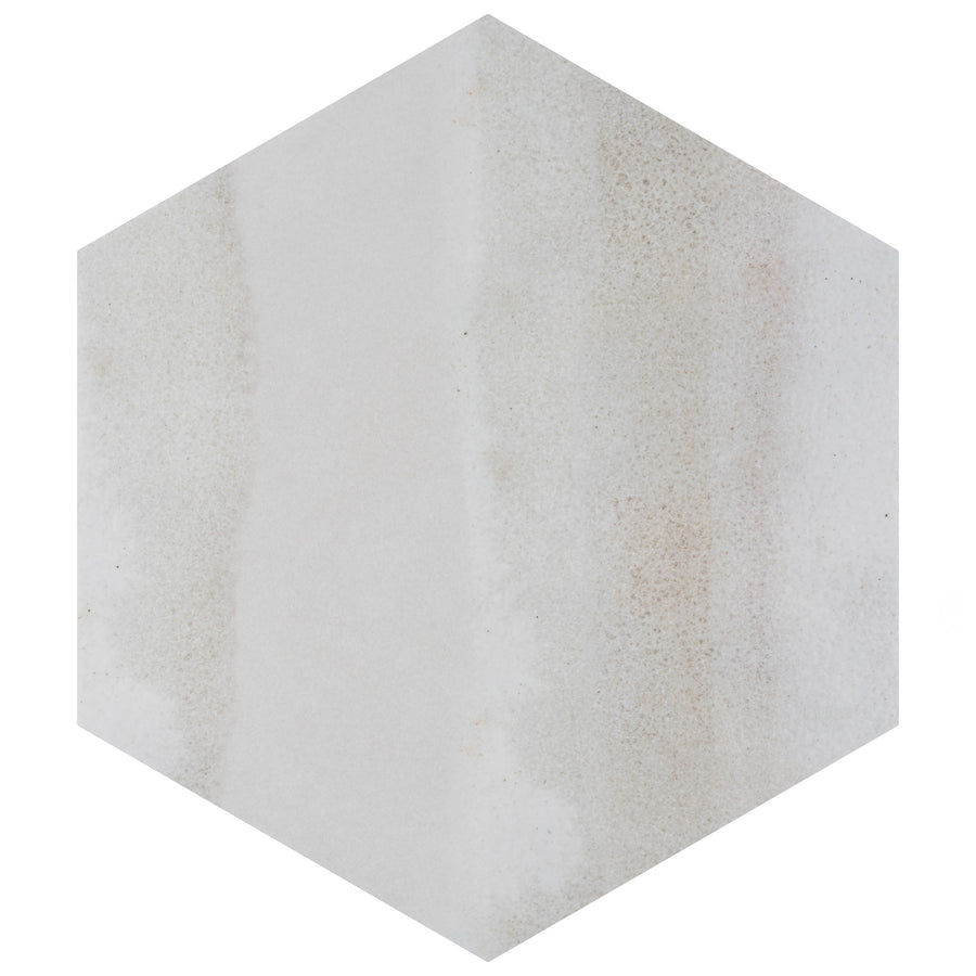 A hexagonal tile with a subtle, light gray and beige marbled pattern, featuring soft gradients and minimal texture.